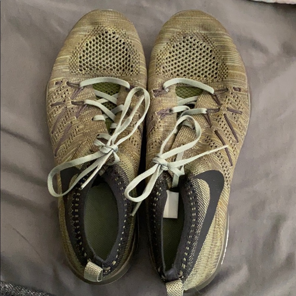 Dark green Nike tennis shoes